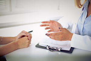 Eye Doctor discussing LASIK with a patient